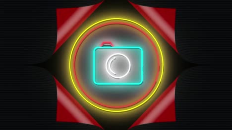 animation of flashing neon camera icon in red and yellow rings on black background