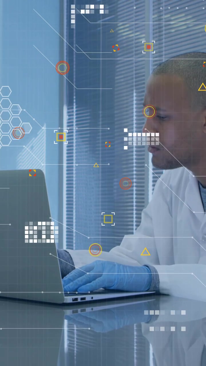 Animation of white pixels of processing data over male scientist using laptop in laboratory
