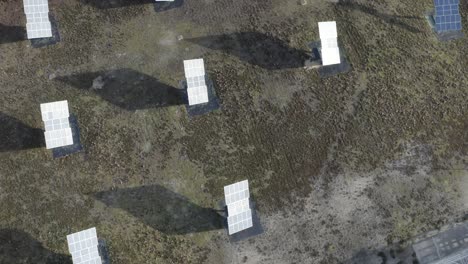 top-down aerial view of multiple solar panels arranged in rows on ground, renewable energy generation, castets, france
