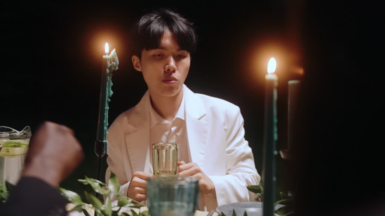 People having dinner in candlelight