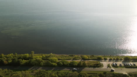 cars driving on the road in kuznica, a popular polish seaside resort in pomeranian voivodeship, northern poland - high angle shot