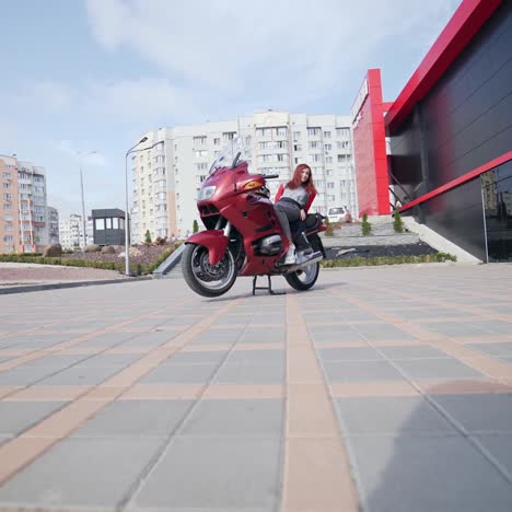 biker girl posing on motorbike