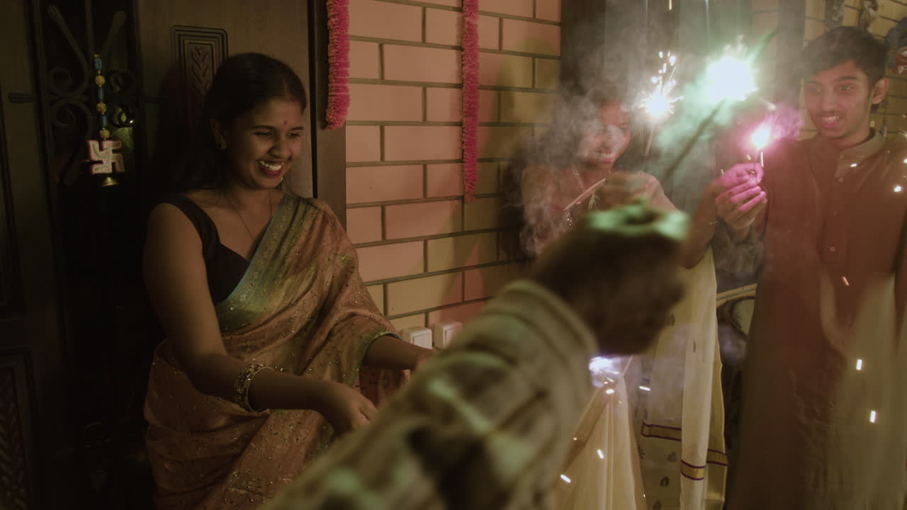 People celebrating Diwali with sparklers