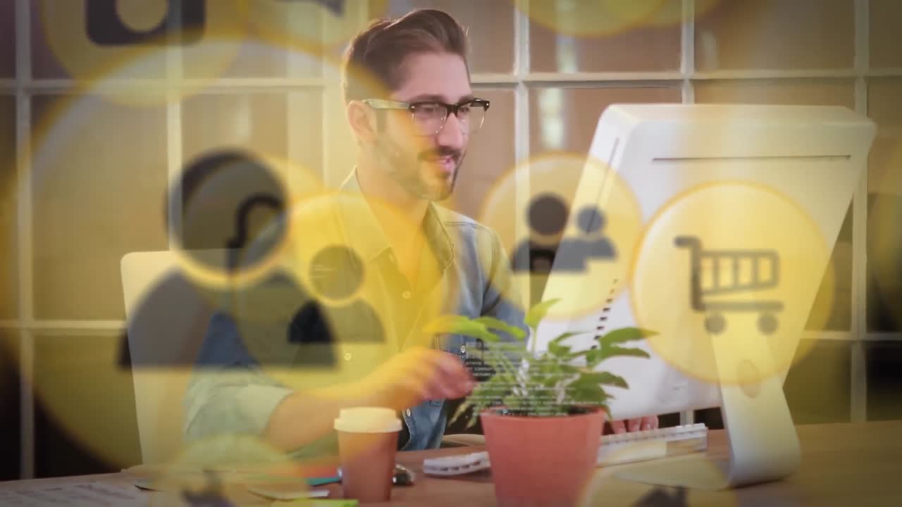 Animation of media icons over businessman using computer