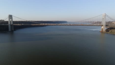 aerial view approaching the george washington bridge, golden hour in new york, usa