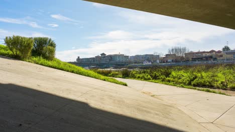 The-Napa-Valley,-Downtown-Napa-area-time-lapse-with-clouds-moving-and-cars-passing-a-bridge