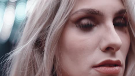 beautiful blonde woman with red lips and beautiful eyes close up