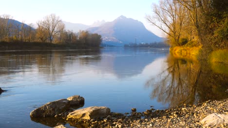 quiet river and rocks in sunlight