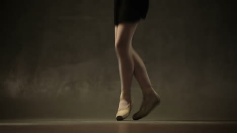 young ballerina with a clothing for performance dancing in the studio