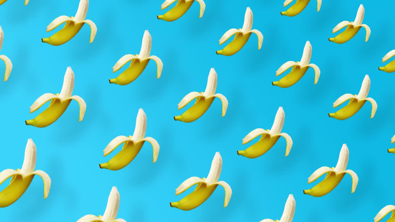 파란색 배경과 그림자를 가진 신선한 노란색 바나나의 다채로운 과일 패턴, 바나나와 함께 원활한 패턴, 현실적인 애니메이션, 4k 비디오 모션