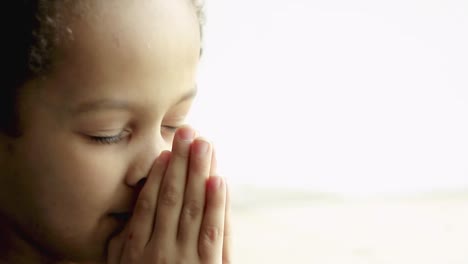 little boy praying to god with hands together on white background with people stock video stock footage