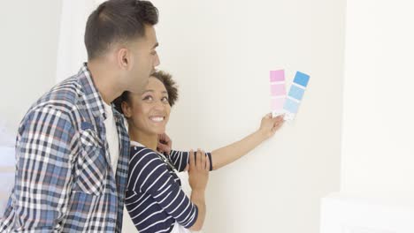 young couple choosing a paint color