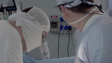 surgeons look at the patient's testicles during the operation