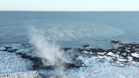 pipe carrying boiling water from geothermal power plant in iceland to ocean