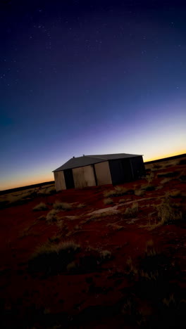 remote structure under a starry desert sky at twilight
