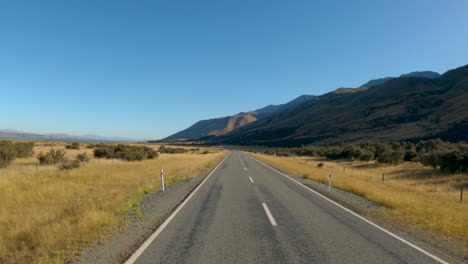 traveling on the asphalt road near twizel town in the south island, new zealand