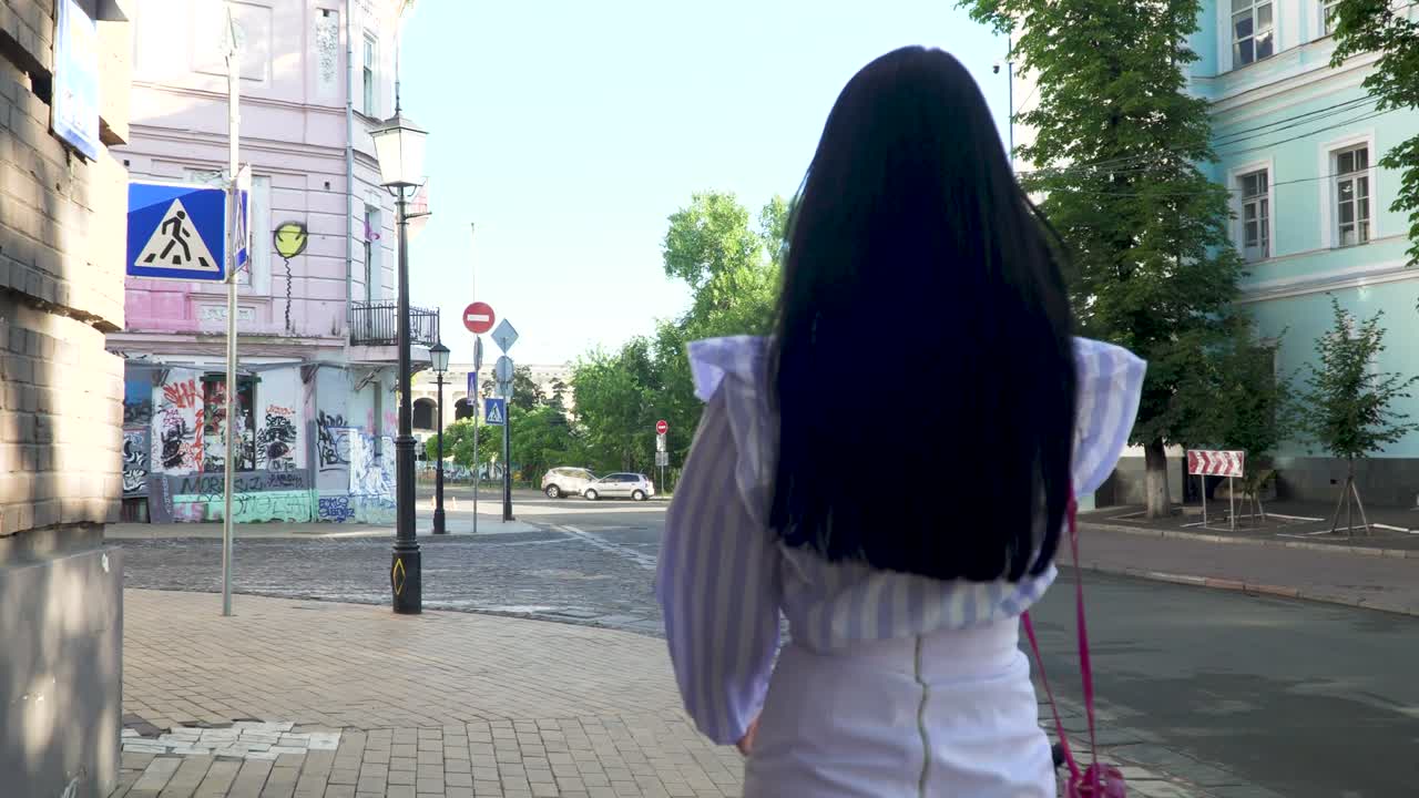 Stylish woman talk on phone walking at urban street