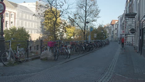 many bicycles parked in urban center in the netherlands