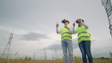 energy engineers use virtual reality glasses to control the solar panel system and deliver energy to consumers. engineers of the future.