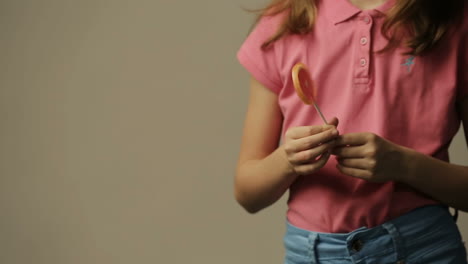 beautiful little girl with candy, studio shot