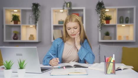 female student suffering from toothache.
