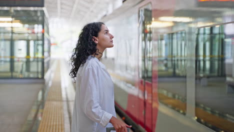 woman waiting at train station
