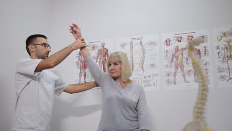 a therapist assists an elderly patient in a clinical setting visual aids in the background enhance a therapist assists an elderly patient in a clinical setting visual aids in the background enhance treatment