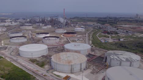 aerial establishing shot of the old empty fuel storage facility in catania, sicily, italy