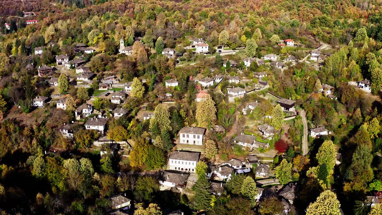Scenic traditional Bulgarian forest village Autumn drone shot