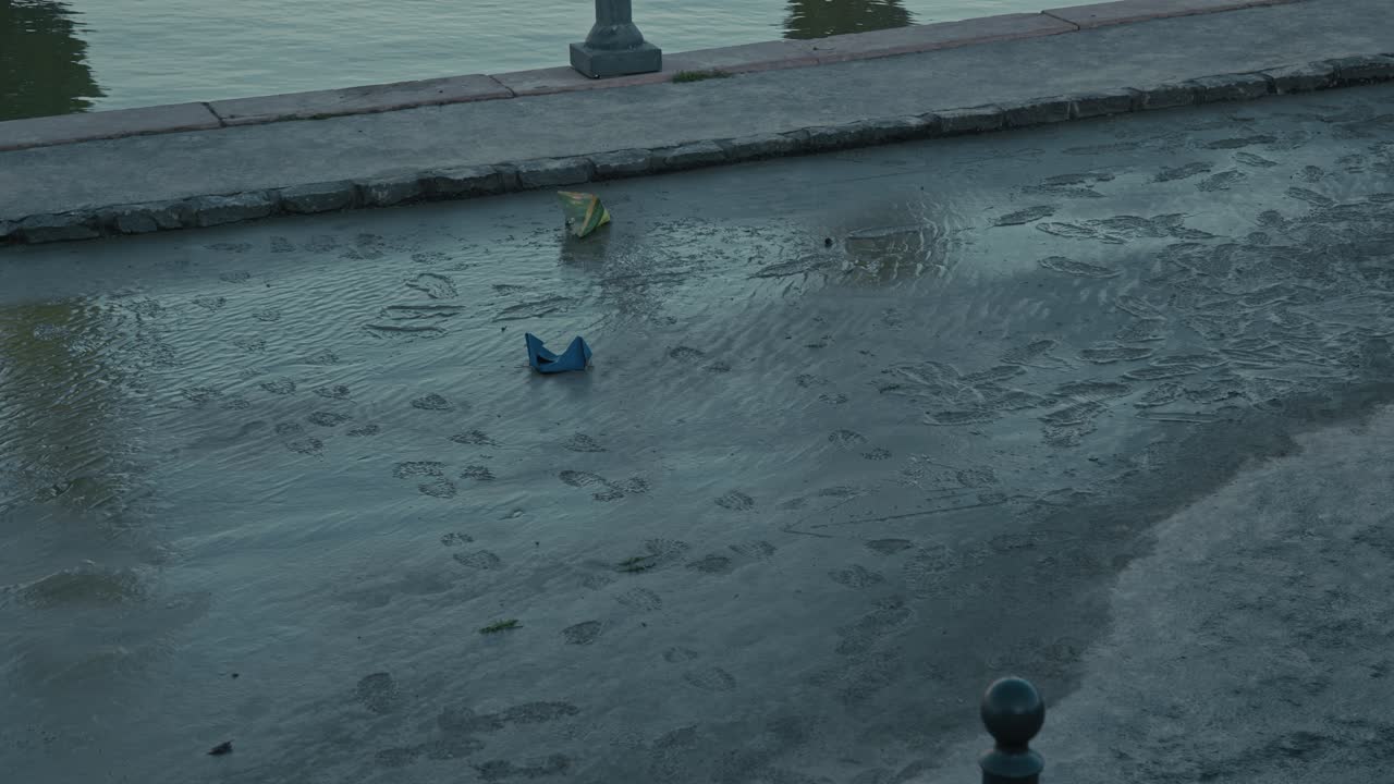 Muddy footprints and debris left on the wet street after receding floodwaters during the Budapest Flood 2024
