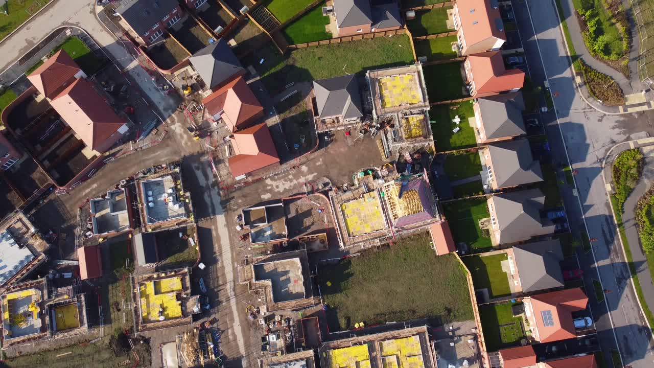 Drone aerial view of house building site in Cheshire, England, UK, Europe, illustrating urban development due to housing shortage in the UK.