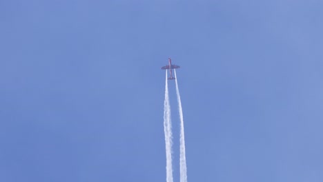 planes execute complex maneuvers with smoke trails