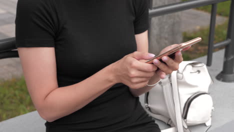 woman using phone in a park