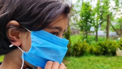 india girl wear medical mask is looking to camera during the second wave of coronavirus in india 2021