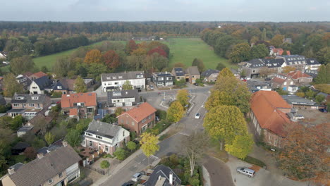 high jib up of small rural town on the edge of green meadows