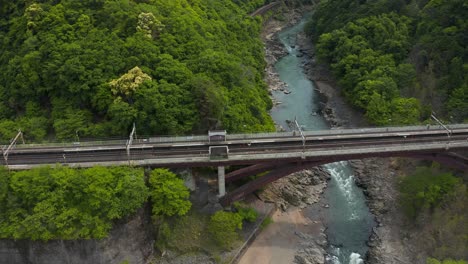 hozukyo bridge and train station in the mountains of kyoto japan