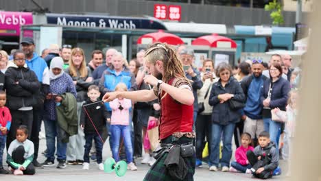 performer entertains crowd with yoyo tricks