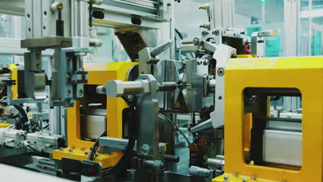 industrial setup robot for electronics factory, advanced robotic machine manufacturing parts in an automated assembly line