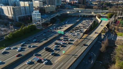 Cars-leaving-busy-interstate-highway-of-american-town-at-sunrise