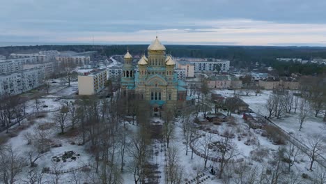 aerial establishing view of orthodox , wide drone shot moving forward