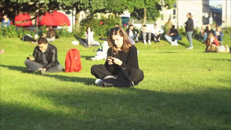 woman using phone in park