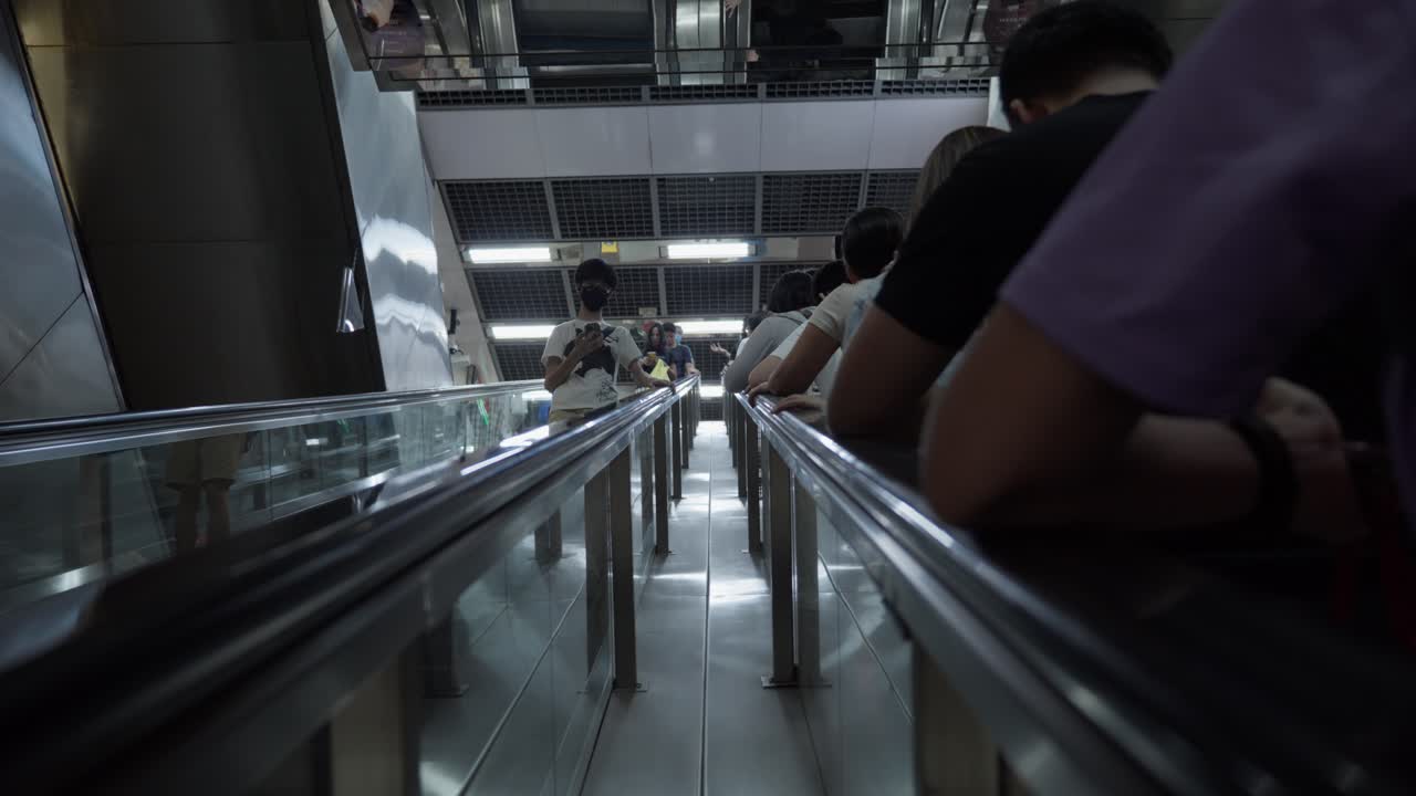 Crowded Passengers On Singapore MRT Station Escalator During Rush Hour.