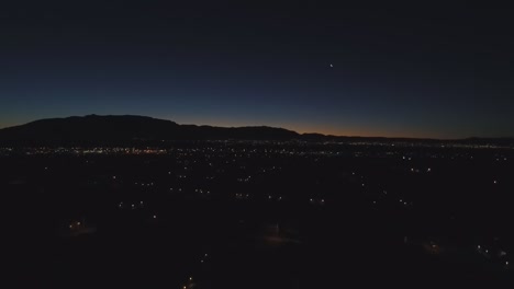 Sunrise-shot-of-the-Sandia-Mountains-and-Albuquerque,-NM