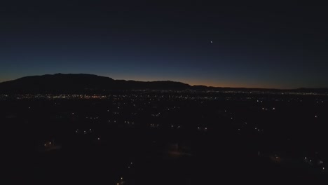 sunrise shot of the sandia mountains and albuquerque, nm