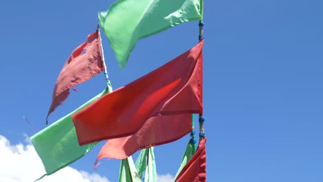 Red-and-green-flags-waving-in-the-wind