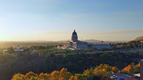 utah state capitol complex with beautiful green gardens illuminated by the setting sun in the fall