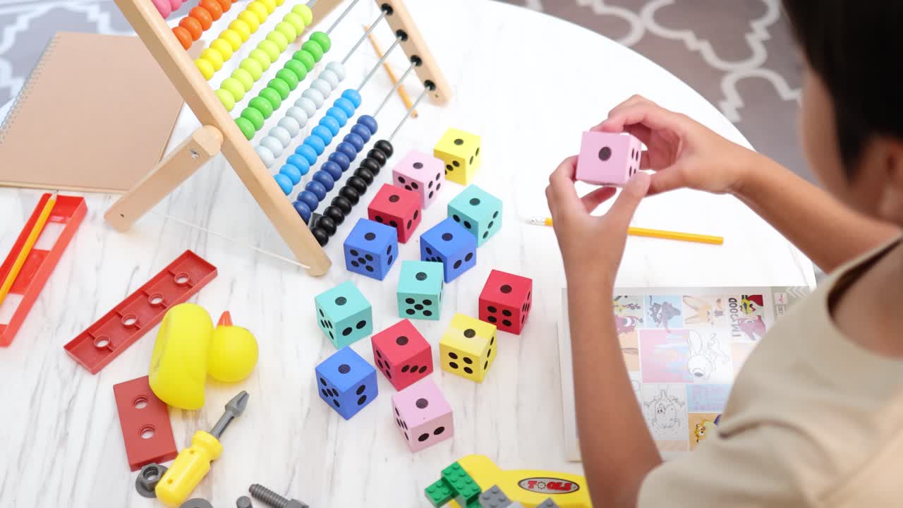 A child engages with colorful educational toys on a table, fostering creativity and learning in a bright, playful environment