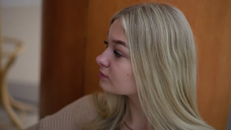 a lady looking contemplative around, appearing as if she is waiting or expecting someone in a quiet and serene environment, she gazes off in the distance, lost in thought, with soft lighting