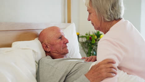 senior, couple and kiss forehead in bed