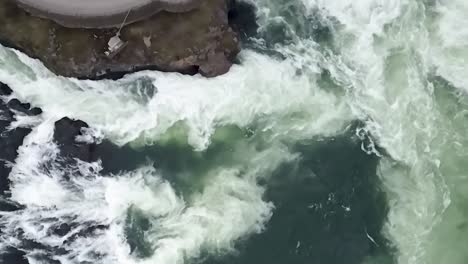 Turquoise-Blue-Water-Cascading-In-Slow-Motion---Spokane-Falls,-Washington---aerial-top-down